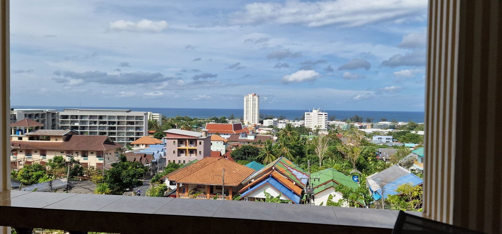 Daytime balcony view over Karon towards the sea
